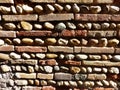 Traditional wall made of round and rectangular stones in south east of France.