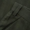 Detail of a checkered dark green trouser belt with loop and pocket