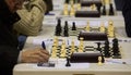 Detail on chess players during gameplay at a local tournament