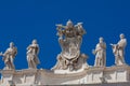 Detail of the Chigi coats of arms and the statues of saints that crown the colonnades of St. Peter Square built on 1667 on the