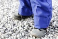 Detail of child legs in overalls - boy in workwear