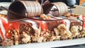 Detail of a Christmas buche of chocolate and red fruits with cramble