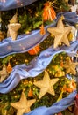 Detail of Christmas tree with gold star ornaments