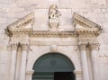 Detail of the church entrance door, Facade of old church in Omis Royalty Free Stock Photo