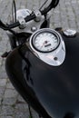 Detail of classic chopper motorcycle black tank with speedometer and chrome details