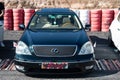 Japanese luxury car, it is a Lexus IS 400 with Japanese flags on the sides, it is black Royalty Free Stock Photo