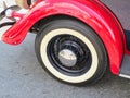 Classic old car, wheel and red fender. Royalty Free Stock Photo