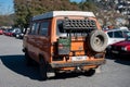 Detail of a classic orange Volkswagen T3 Syncro off-road 4x4 van, rear view