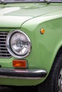 Classic style searchlight of green Lada car, Retro car exhibition PeÂ©cs, Hungary - 23. October 2022