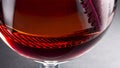 Detail of a clear crystal glass of red wine