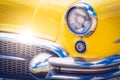 Detail of colorful yellow vintage car headlights Royalty Free Stock Photo