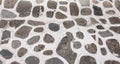 Stone paved street background in Greece.