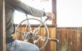 Detail close up of helmsman sailing and controlling helm wheel on river travel Royalty Free Stock Photo