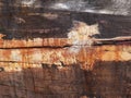Detail and closeup of old and colored boat wooden hull, old painting with cracks and wood texture Royalty Free Stock Photo