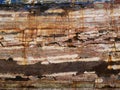 Detail and closeup of old and colored boat wooden hull, old painting with cracks and wood texture