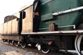 A detail closeup of a steam locomotive releasing steam. Vintage train. Royalty Free Stock Photo