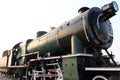 A detail closeup of a steam locomotive releasing steam. Vintage train. Royalty Free Stock Photo