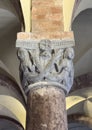 Detail on a closeup view of a capital atop a column in the Basilica of Saint Stephen in Bologna, Rome.