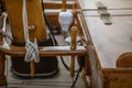 Detail closeup of wooden cleats with nautical moored ropes of sailboat. Royalty Free Stock Photo