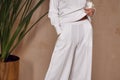 Detail of clothes woman beautiful sexy  wear white cotton knitted suit fashion style for casual collection accessory interior sand Royalty Free Stock Photo