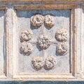 detail of coats of arms in stone