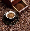 detail of coffee mill with coffee beans and cup of coffee Royalty Free Stock Photo