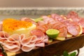 Detail of a cold cuts board on the table. Royalty Free Stock Photo