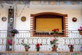 Detail of a colonial house. balcony with flowers and plants Royalty Free Stock Photo