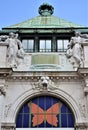 Detail, with colored butterfly on a blue background, of the large pavilion located in the museum district in Vienna.