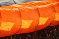 Detail of colorful bright parachute on the ground Royalty Free Stock Photo