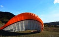 Detail of colorful bright parachute on the ground Royalty Free Stock Photo