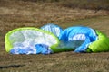 Detail of colorful bright parachute on the ground Royalty Free Stock Photo