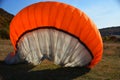 Detail of colorful bright parachute on the ground Royalty Free Stock Photo