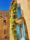 Detail of colorful glazed bay window. Old wooden house, windows and blue sky. High quality photo. Windows with shutters. Wooden Royalty Free Stock Photo