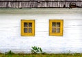 Detail of colorful windows on old traditional house Royalty Free Stock Photo