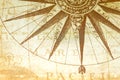 Detail of the compass rose on an old map pointing the directions