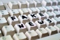 Detail of a computer keyboard with the writing Fake news with a marker on it Royalty Free Stock Photo