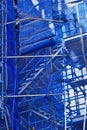 Detail of Tall Scaffolding With Blue Safety Mesh Cladding Royalty Free Stock Photo