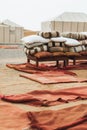 Heap of many different pillows and red rug carpets in glamping camp Morocco Royalty Free Stock Photo