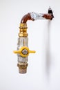 Detail of a copper gas pipe with yellow valve