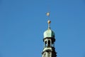 Detail of the copper tower of the town hall in the Pardubice town of Czech Republic with golden flag with horse Royalty Free Stock Photo