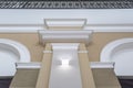 Detail of corner ceiling with intricate crown molding on column with spot light Royalty Free Stock Photo