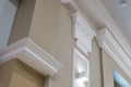 Detail of corner ceiling with intricate crown molding on column with spot light Royalty Free Stock Photo