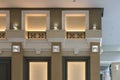 Detail of corner ceiling with intricate crown molding on column with spot light