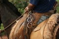 Detail of cowboy outfit mounted on horse saddle Royalty Free Stock Photo