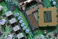 Detail of a CPU Processor over his Socket on a Motherboard. Printed Circuit Board - Computer Motherboard with Components. Close-up Royalty Free Stock Photo