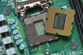 Detail of a CPU Processor over his Socket on a Motherboard. Printed Circuit Board - Computer Motherboard with Components. Close-up Royalty Free Stock Photo