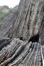 Detail of crazy rock formations geological phenomena called flysch to be found in Itzurun beach, Zumaia, Spain. Royalty Free Stock Photo