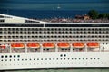 Detail of a crouded cruise ship moving through San Marco canal in Venice, Italy