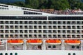 Detail of a crouded cruise ship moving through San Marco canal in Venice, Italy